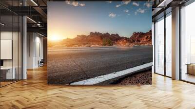 Empty long nevada mountain road to the horizon on a sunny summer day at bright sunset Wall mural