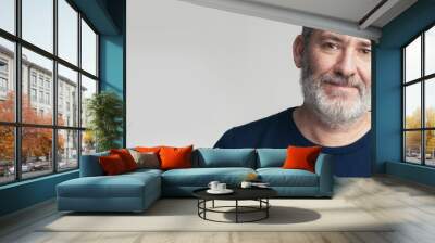 Portrait of a bearded mature adult casual Businessman looking into camera Wall mural