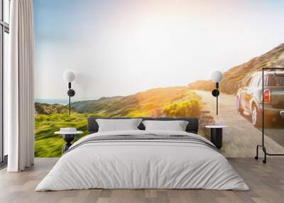 rental car in spain mountain landscape road at sunset Wall mural