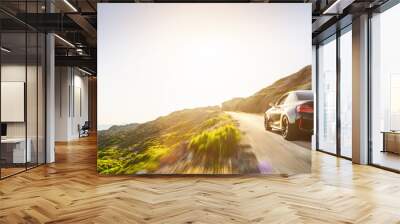 rental car in spain mountain landscape road at sunset Wall mural