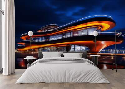 Futuristic architecture with orange glowing elements against a dark blue night sky Wall mural