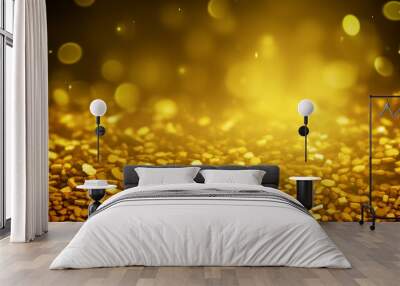 Golden glittering particles background with glowing lights and shiny sparkles. Wall mural