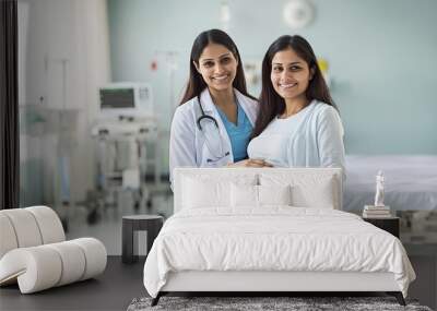 Indian pregnant woman standing with her female doctor in the hospital, supportive care and consultation, hospital and clinic, prenatal care Wall mural