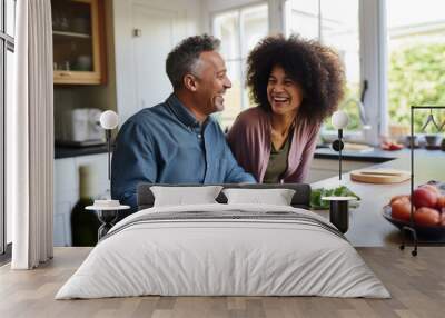 Married young multiracial couple cooking in the kitchen Wall mural