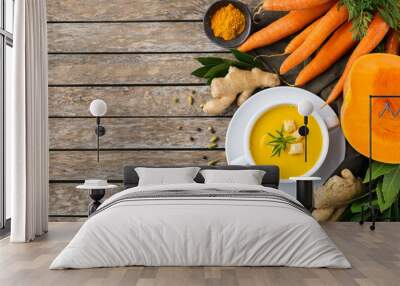 Seasonal spicy fall autumn creamy pumpkin and carrot soup Wall mural