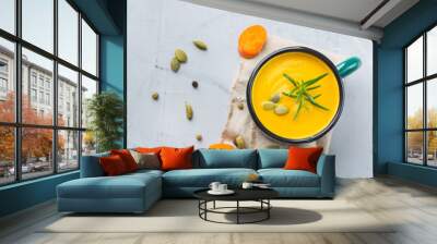 Seasonal spicy fall autumn creamy pumpkin and carrot soup Wall mural