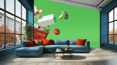 Basket with foods on green background. Supermarket shopping concept. 3d rendering Wall mural