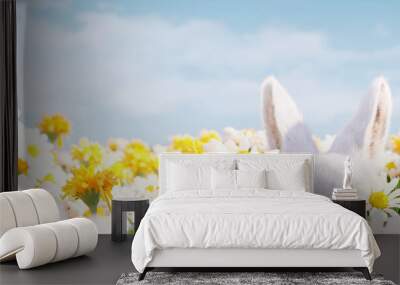 White bunny in flower field with blurred  sky background. Easter spring concept. 3d rendering Wall mural