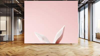 White rabbit ear on pastel pink background. Easter day. 3d rendering Wall mural