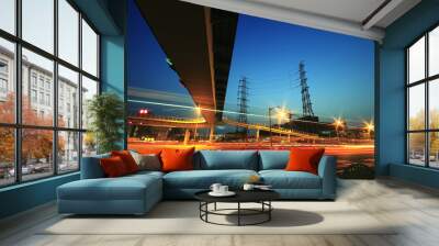 long exposure of cars passing through of transmission tower Wall mural