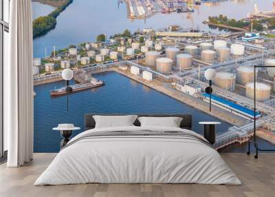 Aerial view of large fuel storage tanks at oil refinery industrial zone in the cargo seaport. Wall mural