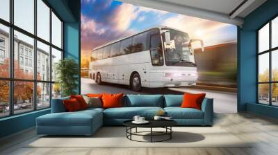 bus driving moving at high motion blur effect speed on a road in the sunset. Wall mural