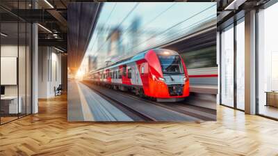 Electric passenger train drives at high speed among urban landscape. Wall mural