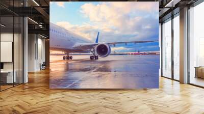 Evening view of a passenger plane wing with engine. Wall mural