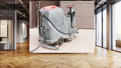 Floor care and cleaning services with professional washing machine the outside of the building drains dirty water. Wall mural