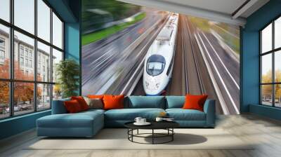 Railroad travel high speed fast train passenger locomotive motion blur effect in the city, top aerial view from above. Wall mural