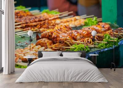 Seafood octopus and other meat balls on a street food stall. Wall mural