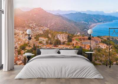 Taormina theater, amphitheater, arena is a town on the island of Sicily, Italy. Aerial view from above in the evening sunset. Wall mural