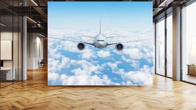 Travel trip vacation airplane is flying above the day clouds. Wall mural