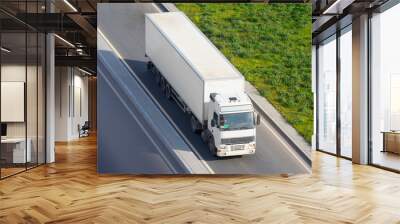 White truck with a trailer on the highway in the city, the concept of transportation. Wall mural