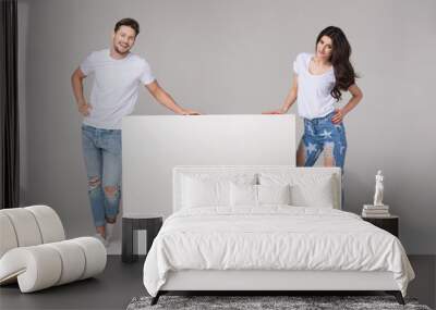 Happy summer couple with white board Wall mural