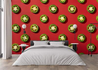 Slice of green jalapeno pattern on red background Wall mural