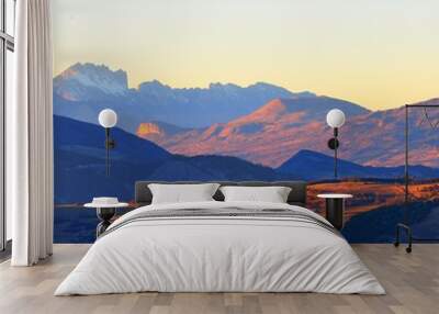 A small mountain village in front of french Alps. Masif des Ecrins Wall mural