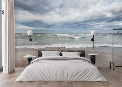 Panoramic view of the Baltic sea from a sandy shore (sand dunes). Dramatic sky with glowing clouds, waves and water splashes. Idyllic seascape. Warm winter weather, climate change, nature. Denmark Wall mural