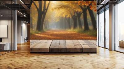 empty wooden table with blurred autumn background Wall mural