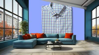 Top up up view shirt folded isolated on blue background. suitable for your design project. Wall mural