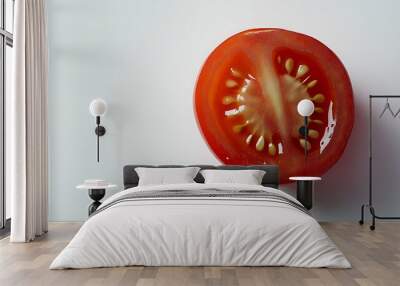 Closeup of Half a Red Tomato with Seeds on White Background Wall mural