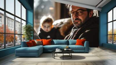 Professional photo of a man sitting on the sofa of his home with in front of a laptop while working from home Wall mural