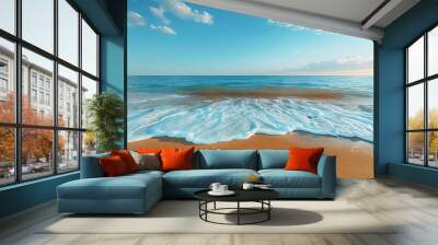 a vertical gradient of light sand, on the shore, the water that reaches the shore and soaks the sand, a calm Mediterranean sea and a soft blue diaphane sky Wall mural