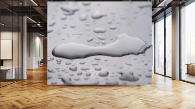 Close up of water droplets on grey car. Wall mural