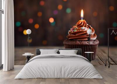 A chocolate birthday party cupcake with one candle and confetti on blurred background. Generative AI Wall mural