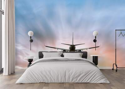 Airplane flying in the blue sky Wall mural