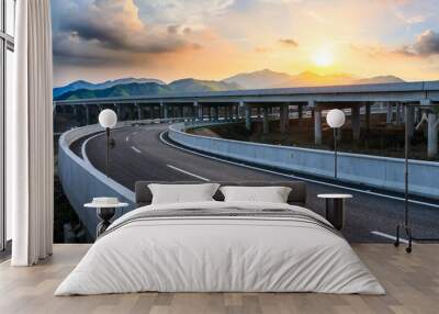 Asphalt highway and mountain landscape at sunset,road pavement background. Wall mural