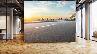 Asphalt highway road and mountains with city skyline at sunset in Chongqing Wall mural