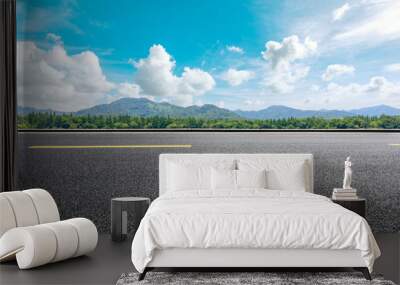 Asphalt road and beautiful mountain under the blue sky Wall mural