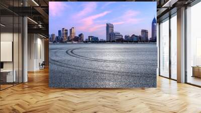 Asphalt road and city skyline with modern buildings scenery at dusk in Shanghai. Famous Bund buildings in Shanghai. Wall mural