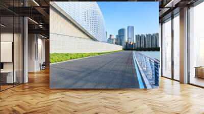 Asphalt road with modern city buildings scenery. car background. Wall mural