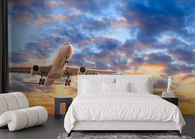 Commercial airplane flying in beautiful sky at sunset,travel concept. Wall mural