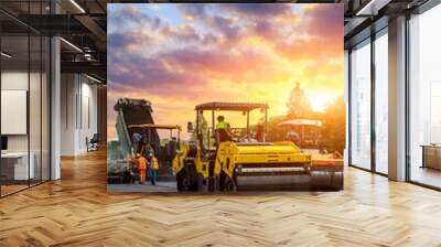 Construction site is laying new asphalt pavement. road construction workers and road construction machinery scenery. Highway construction site scene in China. Wall mural