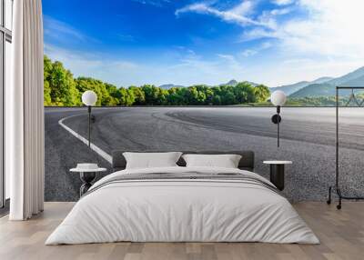 Empty asphalt race track and beautiful natural landscape Wall mural