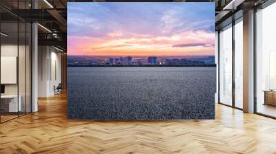 Empty asphalt road and modern city skyline with building scenery at sunset. high angle view. Wall mural