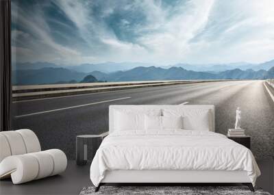 Empty asphalt road and mountains with beautiful clouds landscape Wall mural