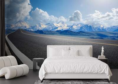 Empty asphalt road and snow mountain natural landscape under blue sky Wall mural