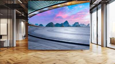 Empty square floor and bridge with karst mountain natural scenery at sunrise Wall mural