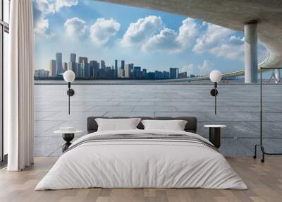 Empty square floor and city skyline with bridge building in Hangzhou, China. Wall mural