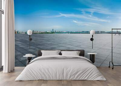 Empty square floor and city skyline with modern buildings under the blue sky Wall mural